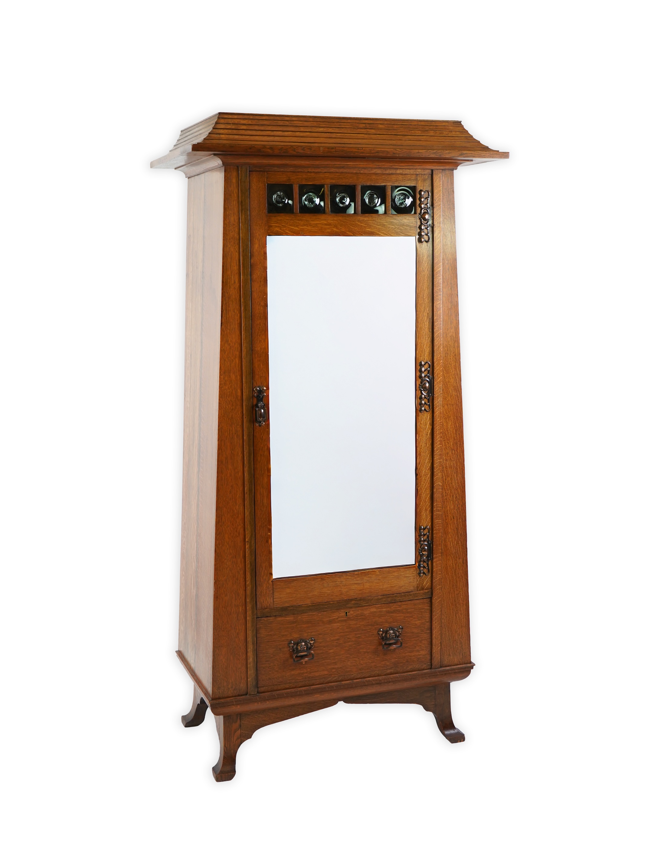 Manner of Liberty & Co: An Arts and Crafts Egyptian revival copper mounted oak wardrobe